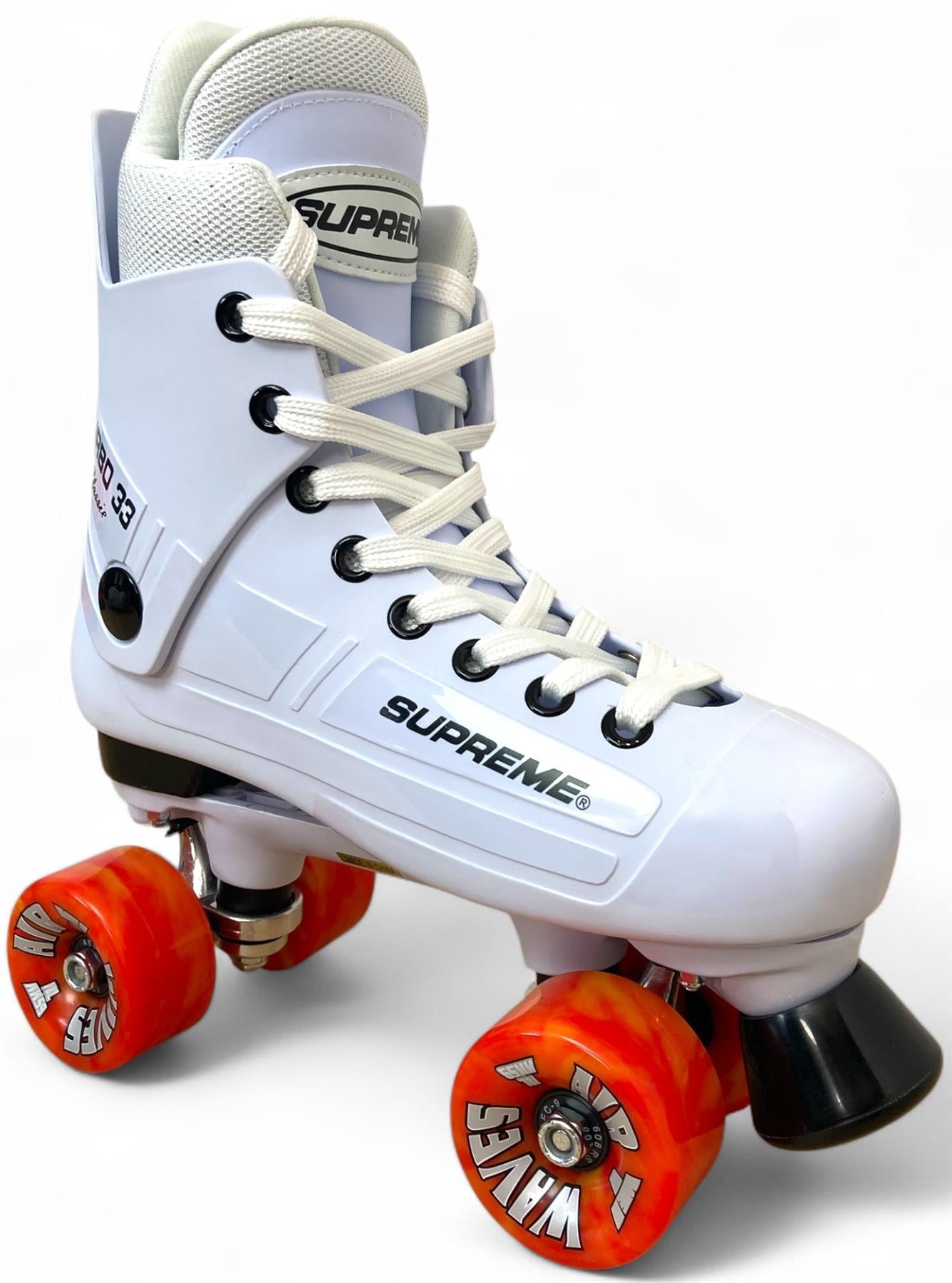 The Supreme Turbo 33 Nylon Quad Roller Skates feature a white boot with red swirl wheels and white laces, displaying the "Supreme" logo on both the boot and wheels, inspired by classic Bauer Turbo 99 skates.