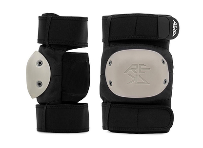 The REKD Shield Triple Skate Protection Pad Set in black/beige features protective pads with gray hard caps, adjustable straps, and embossed "REKD" logos—offering superior action sports protection, displayed against a white backdrop.
