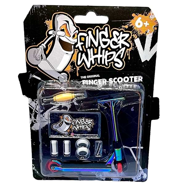 The inventive packaging of the Fingers Whips Finger Toy Scooter - Neochrome, ideal for ages 6 and above, features a stylish miniature finger scooter along with exciting accessories. The backdrop displays a cartoon character clad in extreme sports skate gear, enhancing the adventurous aesthetic of the playful design.