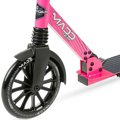 Close-up of the front wheel and frame of a Madd Gear Metro Cruise 250 Foldable Commuter Scooter in Black/Pink, featuring black handlebars, a black wheel with white lettering, and part of the black foot deck.