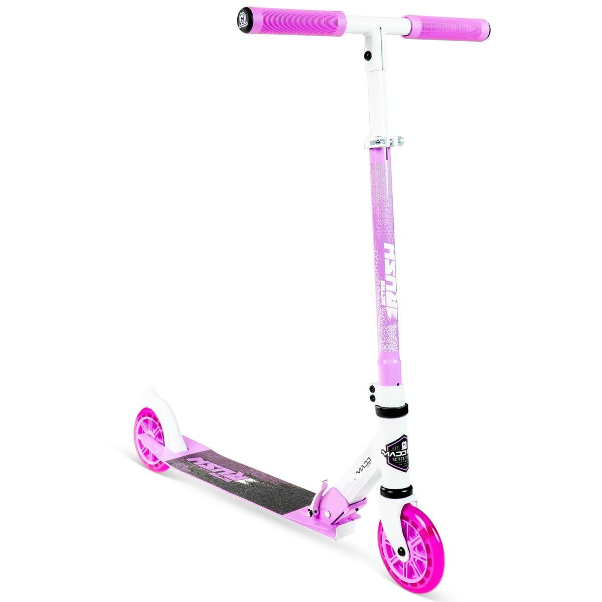 The Madd Gear (MGP) Metro Rush 125 Kids Foldable Scooter in white/purple features light-up wheels, a black deck, adjustable handlebar, and pink grips. This foldable scooter stands upright against a white background.