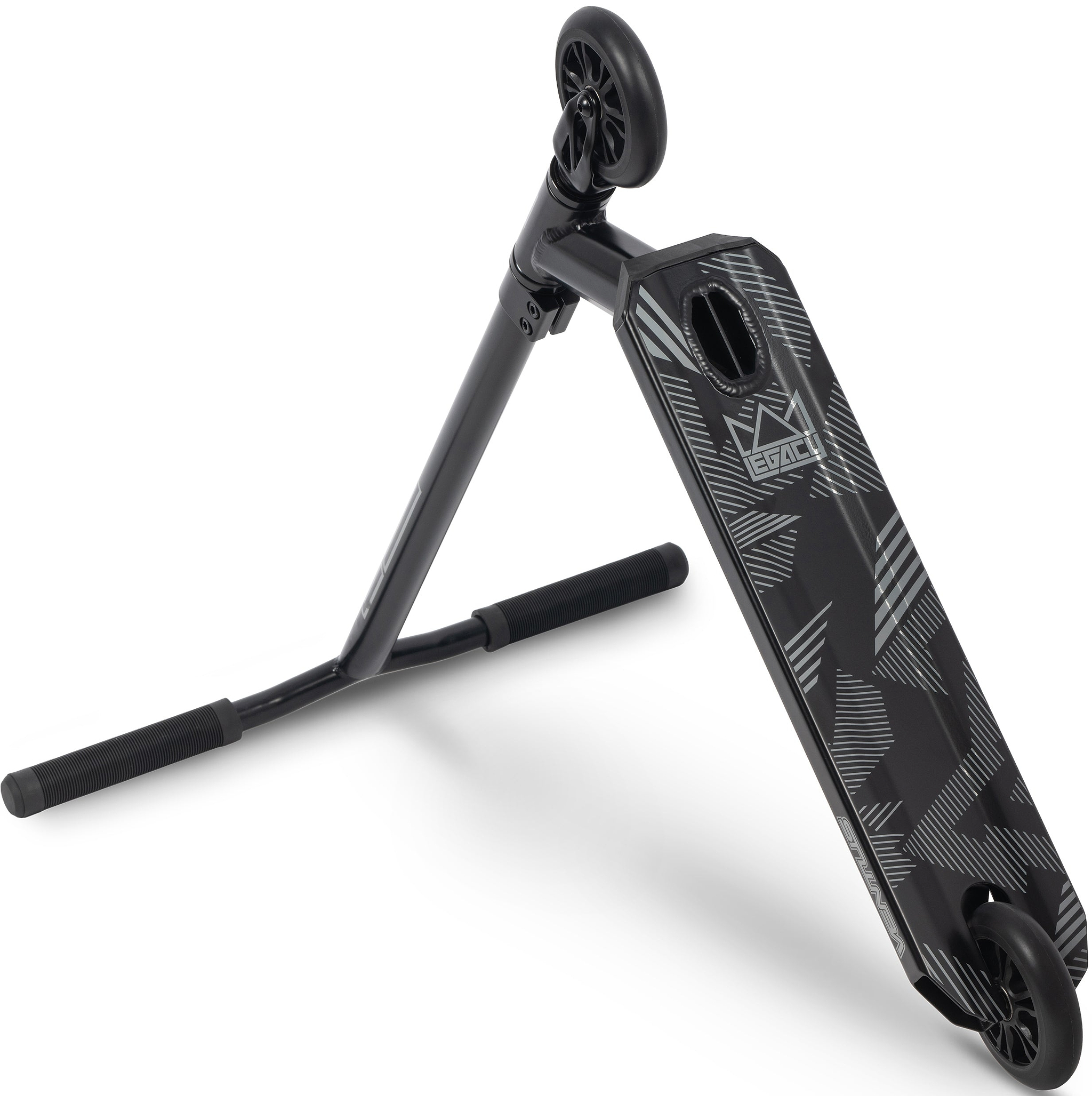 The Legacy Ventus Complete Stunt Scooter by Legacy is shown in black, lying on its side to highlight the patterned deck and two small wheels with handlebars resting on the ground—ideal as a stunt scooter or skatepark scooter for tricks and smooth rides.