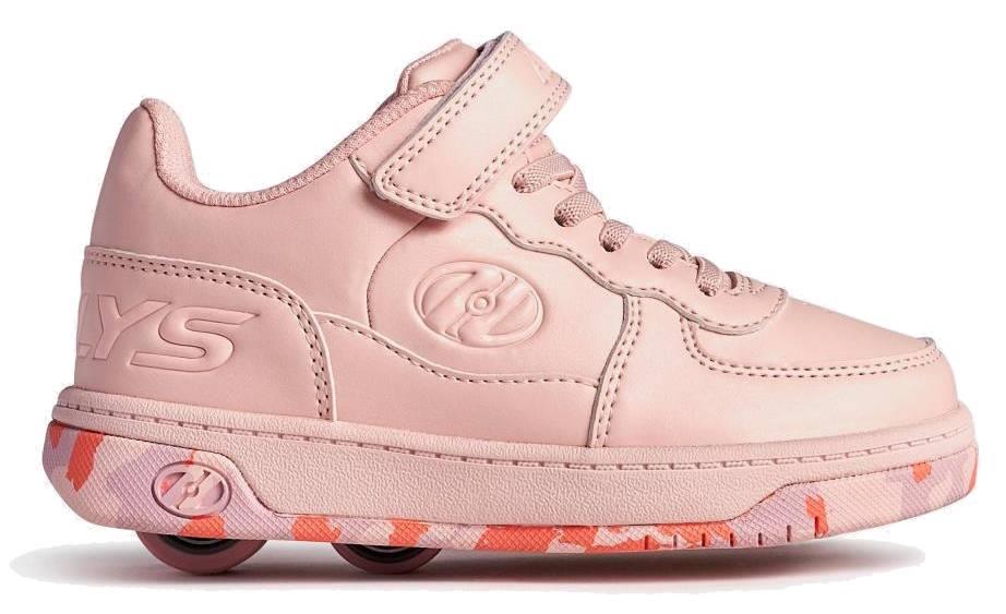 The Heelys Rezerve X2 Girls Shoes in Light Pink/Pink Confetti feature laces, a hook-and-loop strap, two wheels in the heel, a pink camo sole, and an embossed Heelys logo—perfect for beginners.