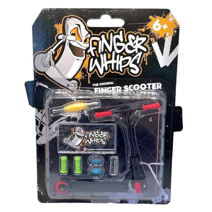 The packaging of the "Fingers Whips Finger Toy Scooter - Black," ideal for ages 6 and up, features a mini finger scooter with colorful components. The blister package contains exciting accessories and displays a lively background with a cartoon character and Finger Whips branding, encapsulating the excitement of extreme sports.