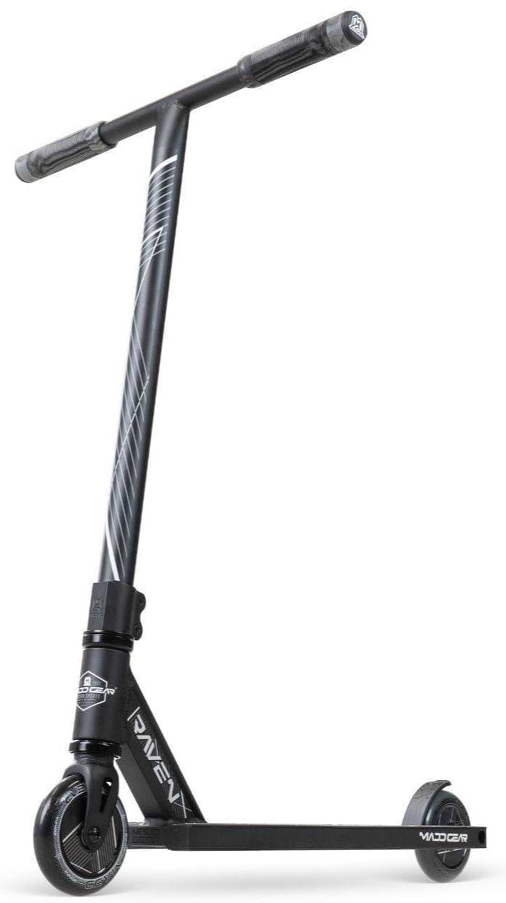 The Madd Gear MG 1 Raven Complete Stunt Scooter in Black/Black features a T-shaped handlebar, angled stem stripes, and a slim "VADER" deck for lightweight performance. It stands upright on a white background.