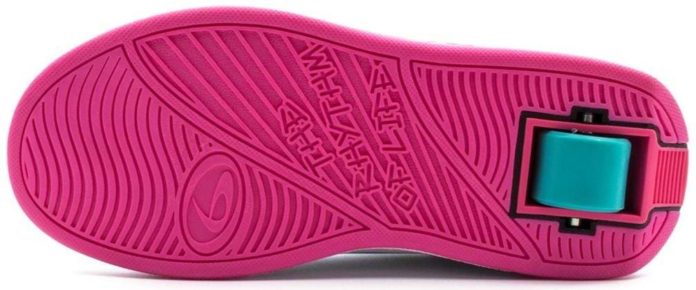 The image shows the sole of a Breezy Rollers Splash Shoe - White / Pink, featuring textured patterns and a large teal retractable wheel with Breezy Rollers’ patented system embedded in the heel.