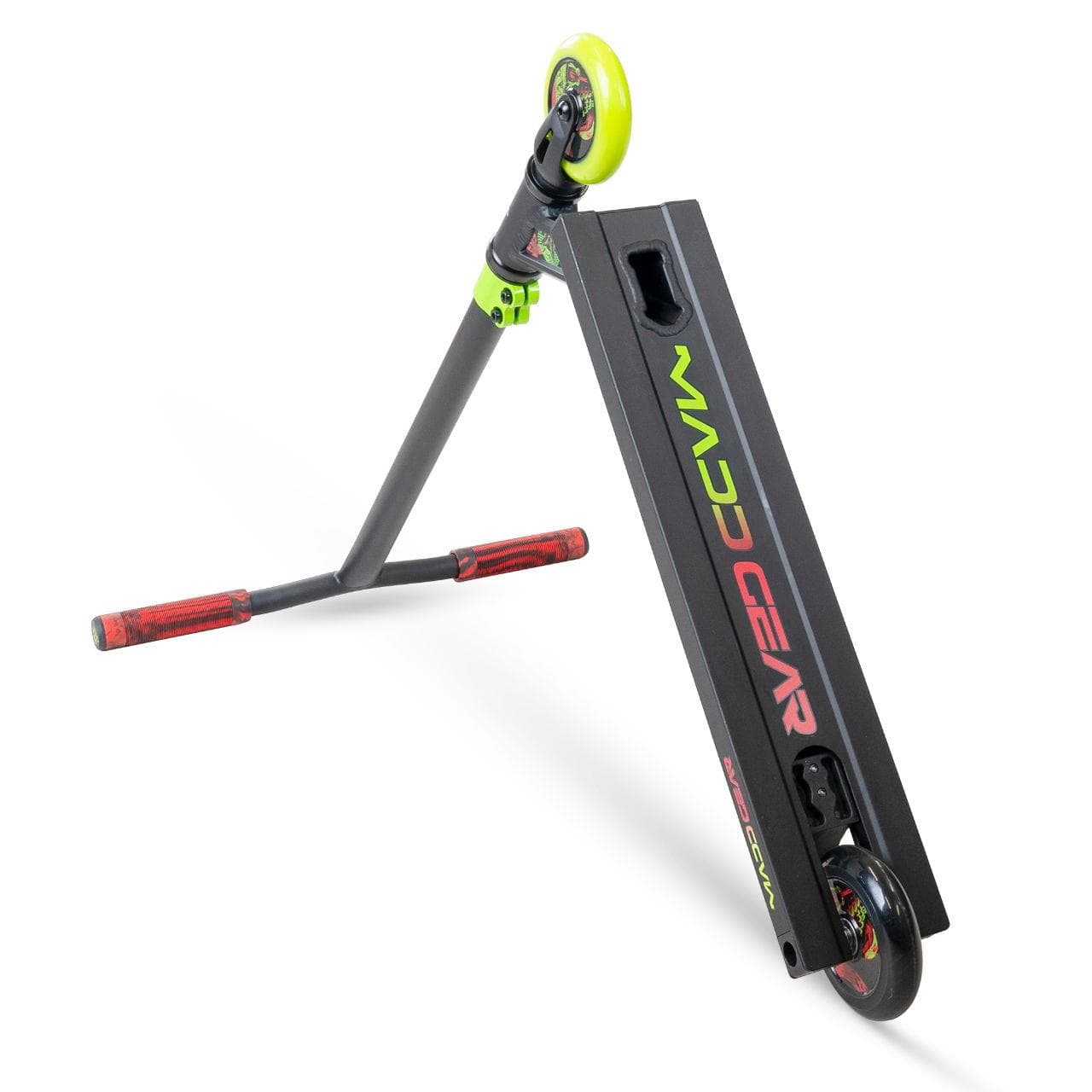 The Madd Gear MG 2 Obsidian Stunt Scooter - Venom features a black and neon green design with "MAD GEAR" branding, red grips, green front wheel, black rear wheel, and ABEC-5 Chrome bearings for smooth rides.