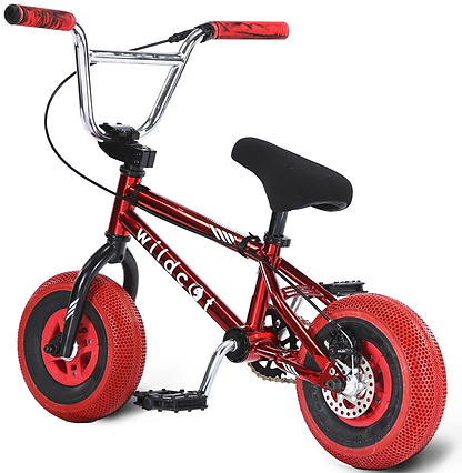 The Wildcat OG 3A Mini BMX Bike by Wildcat features a royal red metallic frame with "Wildcat" on the side, thick treaded PRO Street 65PSI tyres, CNC aluminium wheel rims, a black seat, and chrome handlebars.