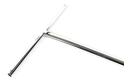 This is a T-shaped metal tool made from chromoly steel featuring shiny, smooth surfaces. The longer vertical bar forms a classic T, similar to the Ethic DTC Trianon Steel Standard ICS/IHC Stunt Scooter Bars in raw silver with dimensions of 670mm x 560mm. The image showcases its angled sections and polished finish.