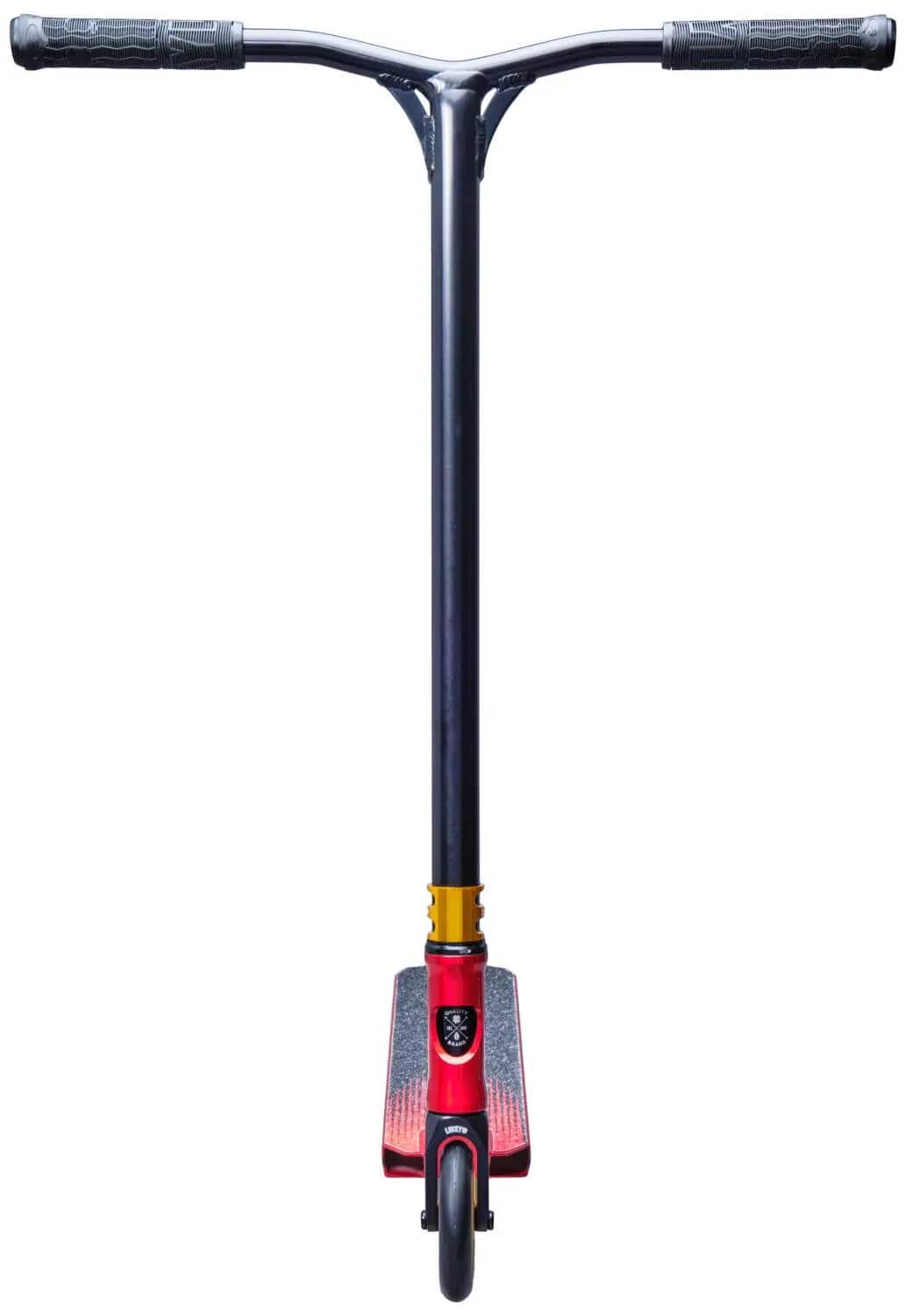 The Lucky Jon Marco Gaydos Signature Stunt Scooter boasts a red deck, black T-bar handle, and gold clamp. It features a skull graphic on the deck. Its single front wheel stands out against the white backdrop.