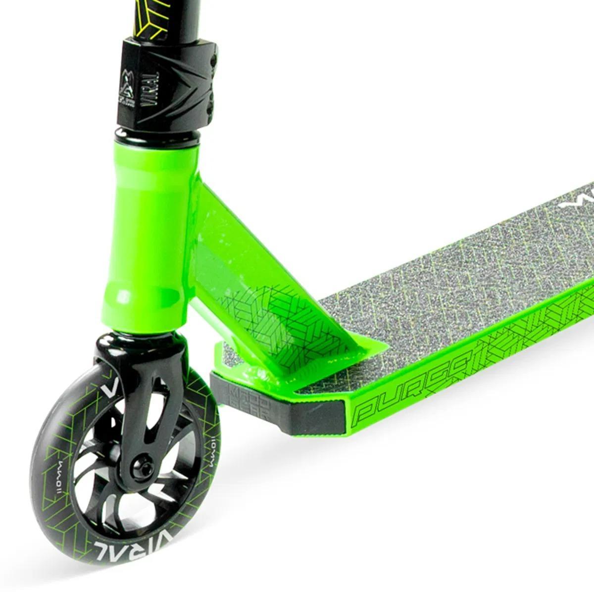 Close-up of the Madd Gear Viral Purge Complete Stunt Scooter - Jade shows its black wheel with a geometric design, griptape deck, and handlebar stem—ideal for kids who love scooters. Brand: Madd Gear (MGP).