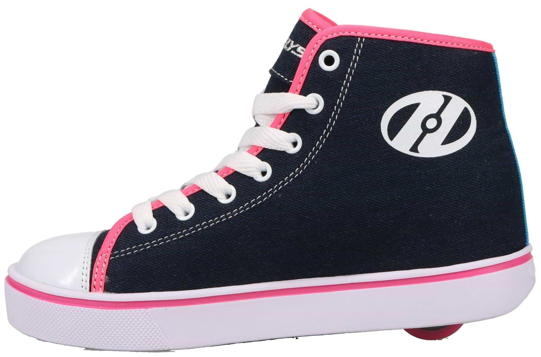 The Heelys Veloz Girls Shoes - Denim / Rainbow are navy denim hi-tops with white laces, pink trim, a white logo and sole, plus low-profile wheels in the heel for smooth rolling. Brand: Heelys.