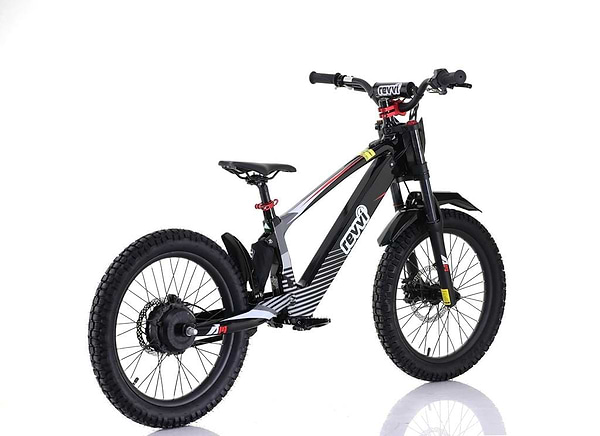 The Revvi 20" Kids Electric Balance Bike - Black combines a sleek and modern design with off-road rubber air-filled tires, a sturdy frame, front suspension fork, disc brakes, and a central motor hub on the rear wheel for electric-powered fun.
