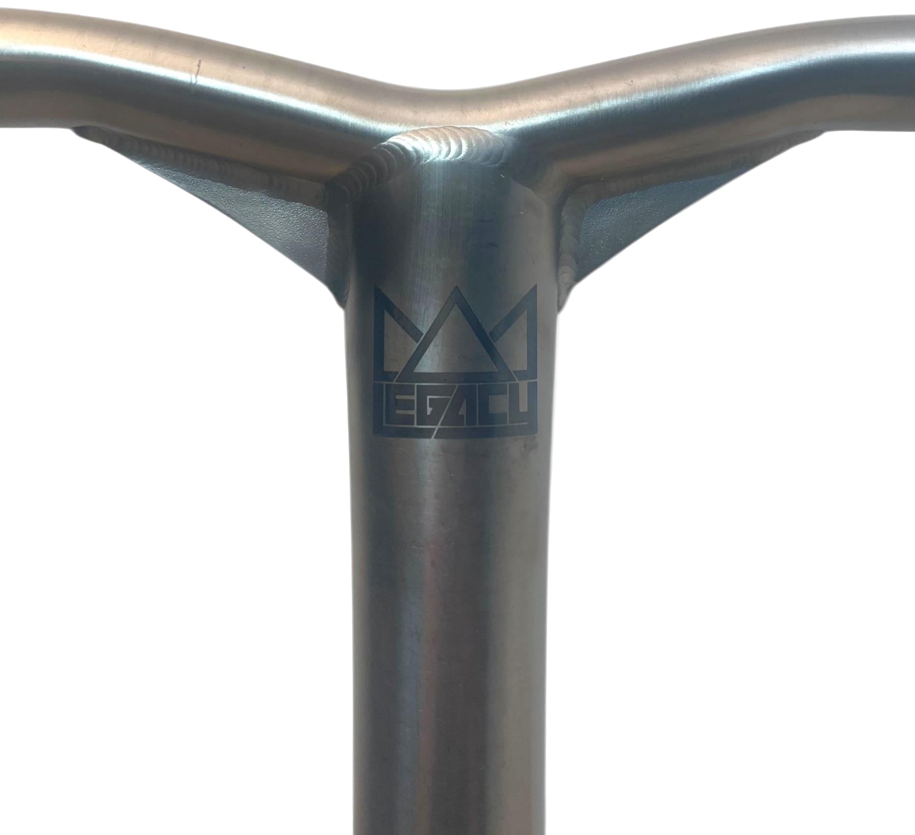Close-up of the Legacy Gusset Titanium Oversized HIC Stunt Scooter Y-Bars (Chrome, 660mm x 600mm) featuring a metallic finish, welded joint, and black "LEGACY" logo with geometric crown shapes on a plain white background.