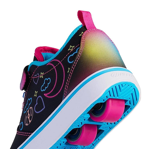 A close-up of the Heelys Pro 20 Prints X2 Girls Shoes by Heelys in black, hot pink, and multi shows neon designs, pink wheels, a blue sole, and a gradient color detail near the heel—stylish wheeled shoes for girls.