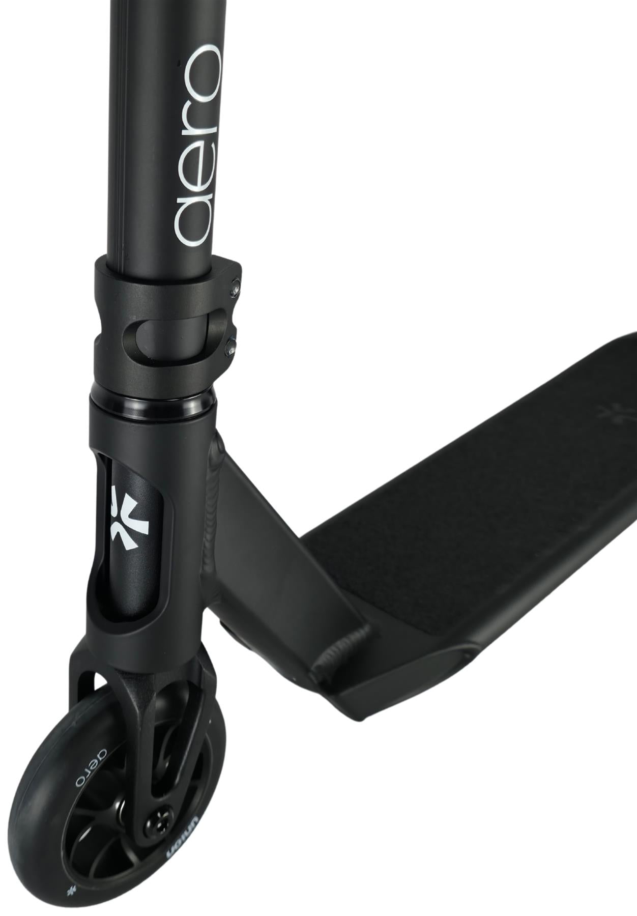 Close-up of the Union Aero Complete Stunt Scooter - Black, highlighting the front wheel, fork, handlebar stem with "aero" branding, and textured footrest.