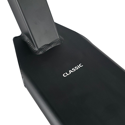 Close-up of the Union Classic Pro Black Stunt Scooter Deck - 4.75" by Union, featuring bold "CLASSIC" lettering on the footplate and sturdy welds by the neck, designed for durability and high performance.