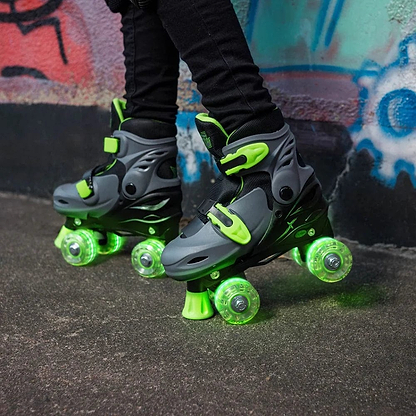 Close-up of a person wearing Xootz LED Adjustable Quad Roller Skates in green, standing on pavement by a colorful graffiti wall.