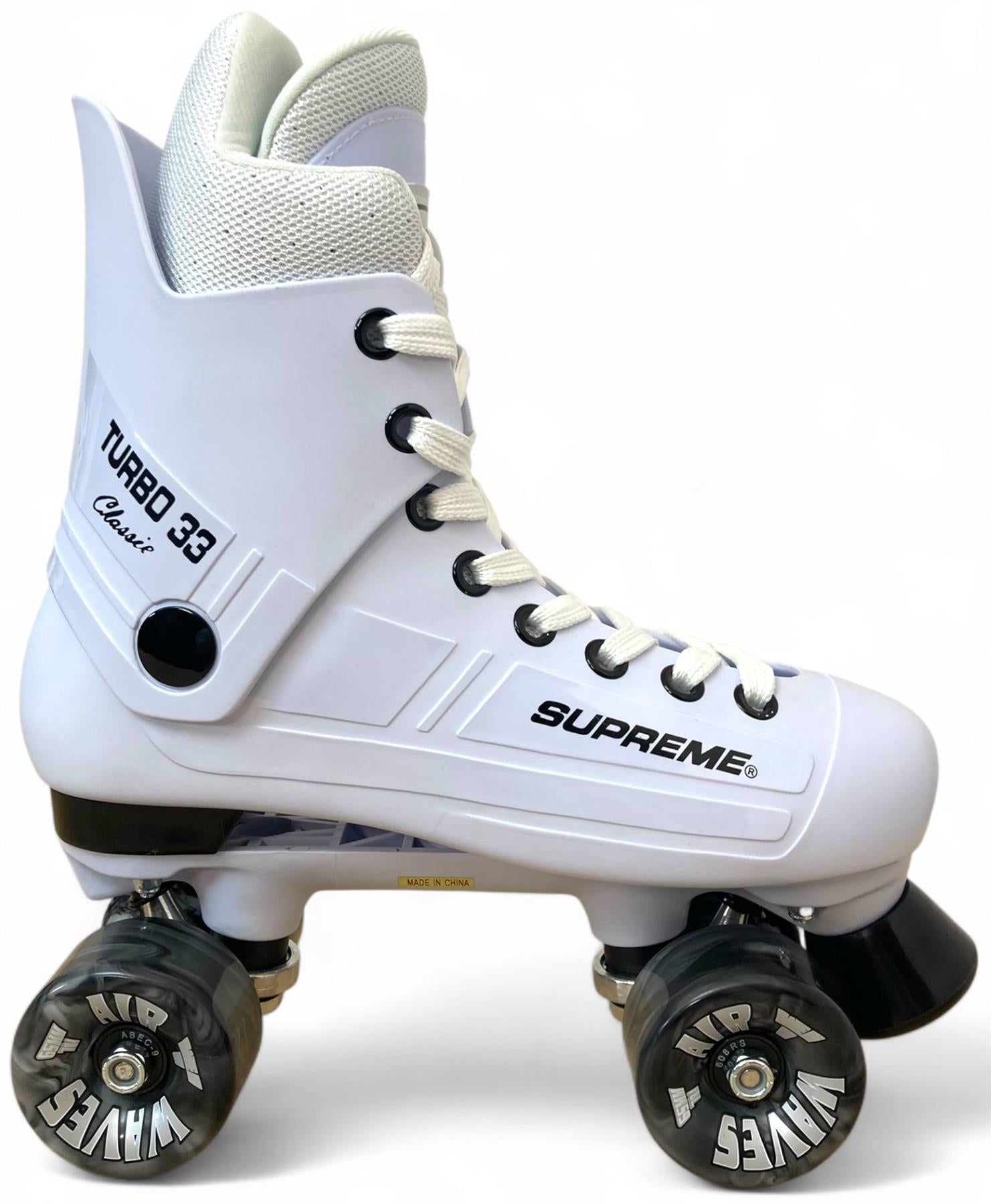 The Supreme Turbo 33 Nylon Quad Roller Skates in white feature black swirl wheels, white laces, a high ankle collar, and retro styling. "Supreme Turbo 33" and "Turbo 33 Classic" appear on the side for extra style.