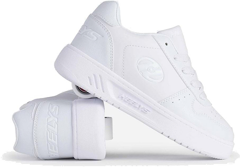 The Heelys Kama Girls Shoes in white are shown with one upright and one on its side, highlighting the low-profile heel wheels. These court-style Heelys shoes feature laces and the iconic Heelys logo.