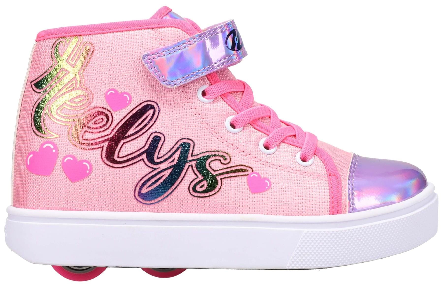 The Heelys Veloz X2 Prints Girls Shoes in Prism Pink/Neon Pink/Multi feature shiny accents, white laces, two low-profile wheels, and “Heelys” in colorful script on the side with playful pink heart details.