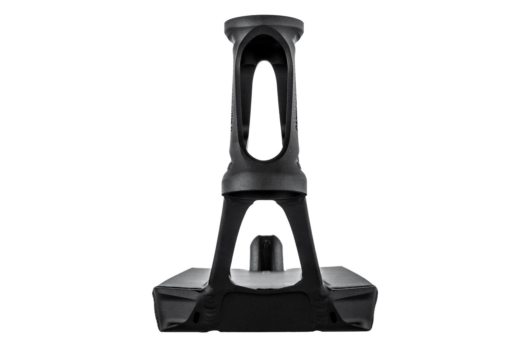When viewed from the front, the ultra-lightweight design of this stand exhibits a black, intricately crafted plastic structure featuring geometric cutouts. Similar to the Ethic DTC Pandemonium V2 Boxed Black Stunt Scooter Deck measuring 5.5" x 22.8", it boasts a rectangular base and a tall, hollow vertical section with an arch-like shape in the middle.