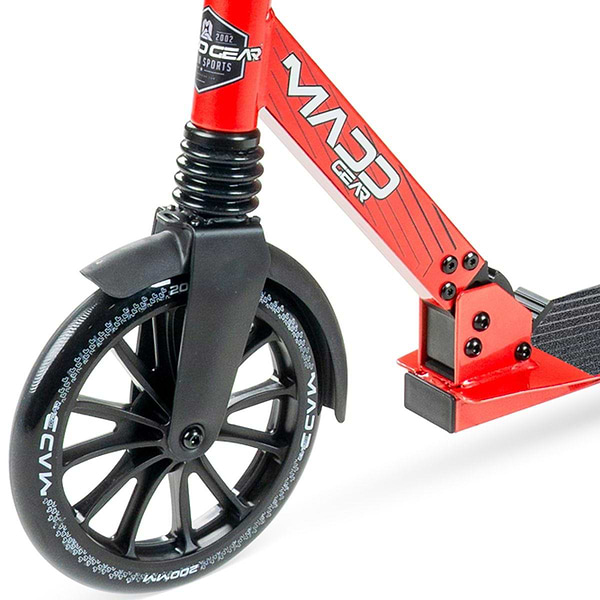 Close-up of the front wheel and deck of a Madd Gear Metro Cruise 250 Foldable Commuter Scooter in black/red, featuring black spokes, detailed tires, and a grip-surfaced footboard.