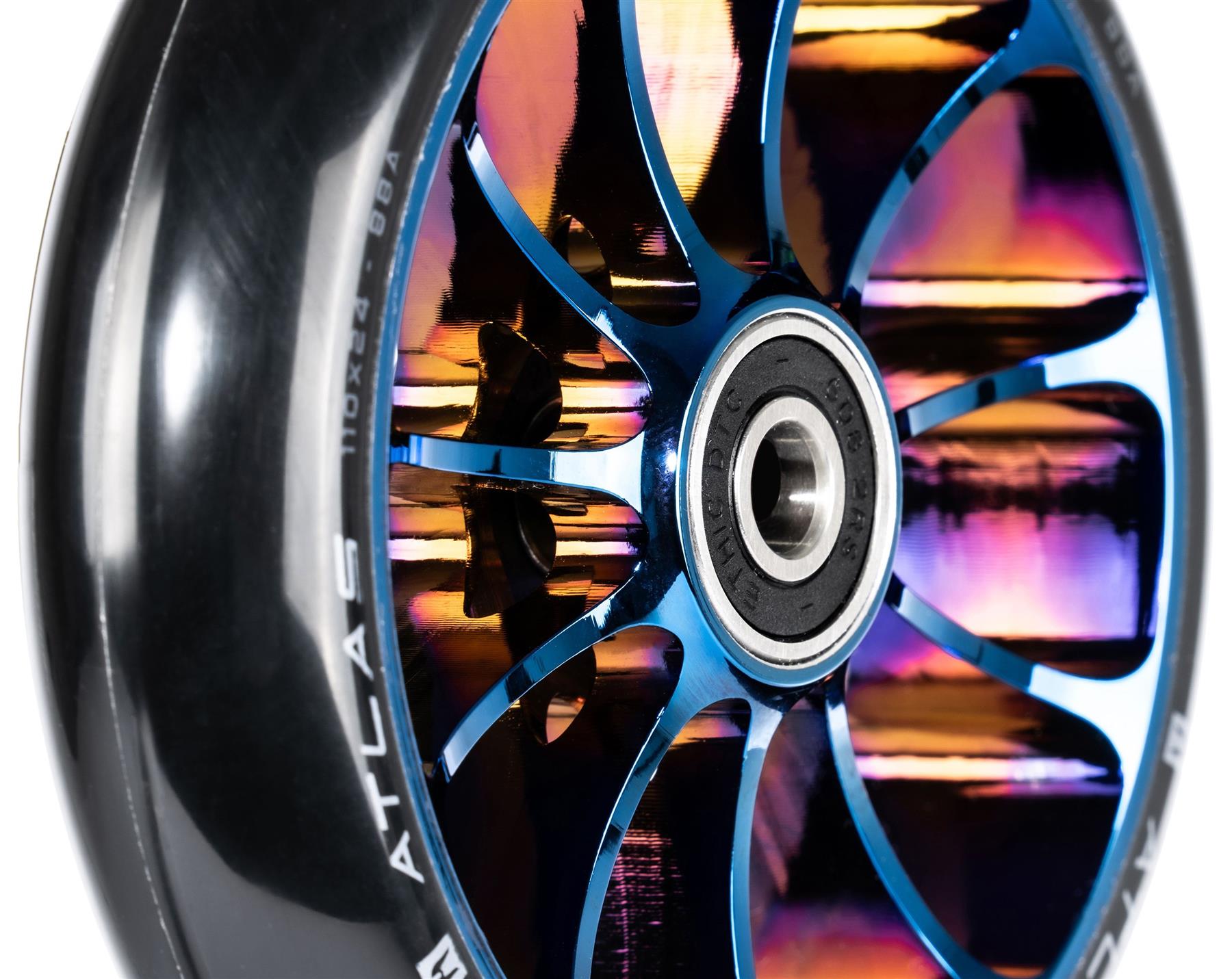 Close-up of the Ethic DTC Atlas 110mm Stunt Scooter Wheel in Chrome Blue, featuring a shiny metallic core with rainbow hues, black rubber outer layer, lightweight build, thin blue spokes, and a visible center bearing.