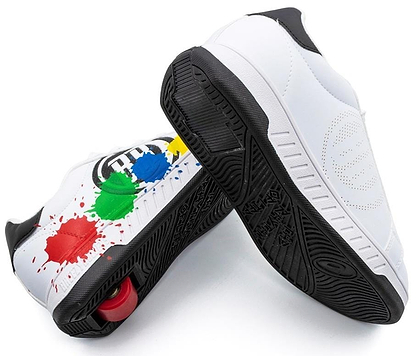 Breezy Rollers Splash Shoes in white, black, and multicolored feature a patented wheel system with visible red wheels, playful paint splatters on one shoe, and a perforated circular design on the other.