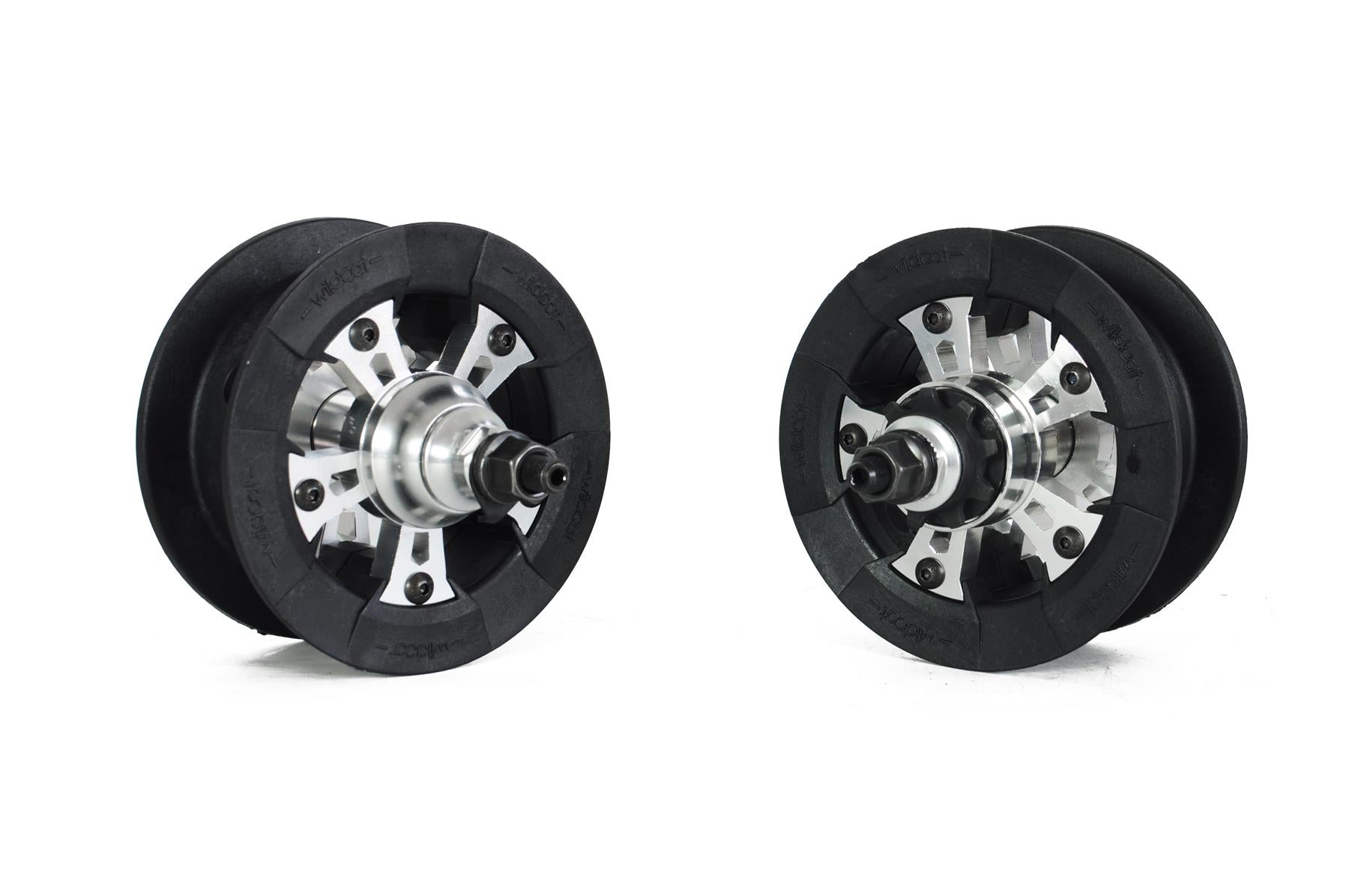 Two black and silver Wildcat pulley wheels for the OG Pro Mini BMX Bike - Joker Blue Neochrome are displayed on a white background, angled to highlight their turbo-inspired design with metal hubs and rubber edges.