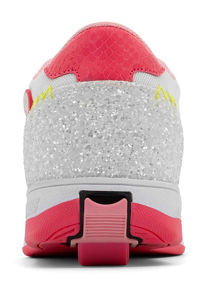 Close-up of the Breezy Rollers Star Girls Shoes in pink/yellow, featuring a glittery silver heel, light pink sole, pink and white upper, and a rectangular heel brake—hinting at Breezy Rollers’ patented wheeled shoe system.