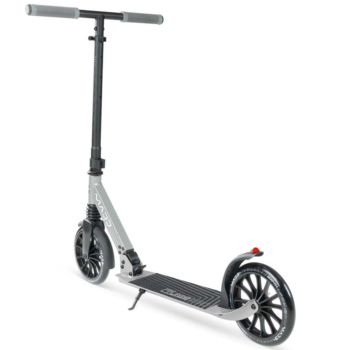 The Madd Gear Metro Cruise 250 Foldable Commuter Scooter by MGP features large wheels, a wide deck, rear fender brake, and textured straight handlebars. Shown angled on a white background in black and grey.