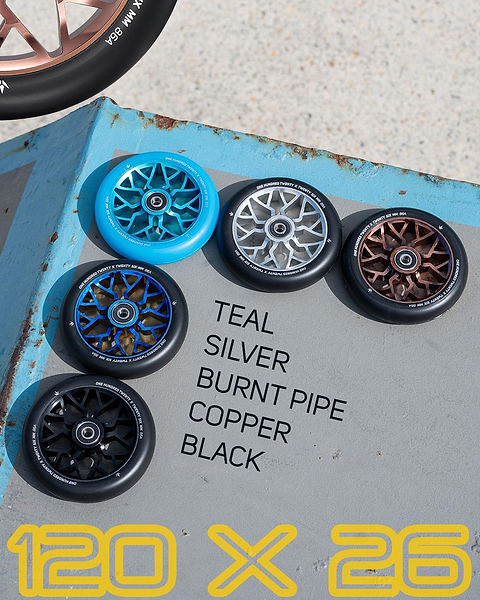 Six Blunt Envy Sector 120mm Stunt Scooter Wheels in teal, silver, burnt pipe, copper, and black are shown on concrete with color labels. Bold yellow text below says "120 X 26." Featuring the Blunt Envy Sector 120mm Wheel - Silver.