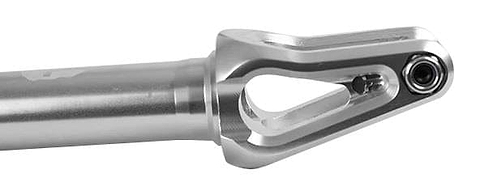 A close-up of the Supremacy Spartan SCS/HIC Stunt Scooter Forks shows a CNC milled, metallic component featuring a cylindrical shaft and a forked, open-ended connector with a small circular opening at the tip. Crafted from high-grade aluminum, this product boasts a sleek chrome finish under the Supremacy brand.