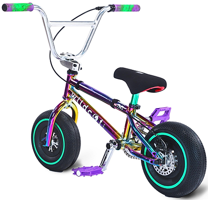 The Wildcat OG Pro Mini BMX Bike - Joker Green Neochrome features a compact design with thick tires, an iridescent green neochrome frame, black seat, and teal and purple accents on the pedals, handlebars, and wheels.