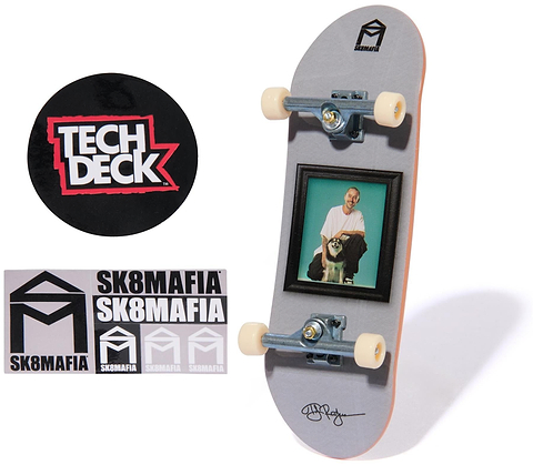 The Tech Deck 96mm M57 Fingerboard - SK8Mafia by Tech Deck features a photo of a man and dog on the deck, SK8MAFIA stickers, and a round Tech Deck logo sticker, all displayed on a white background—ideal for fingerboard fans.
