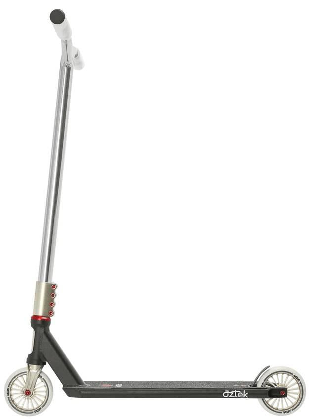 The Aztek Corsa Complete Stunt Scooter in black features a silver and black design with red accents, straight handlebar, small metallic wheels, and "Aztek" branding on the deck, displayed against a white background.
