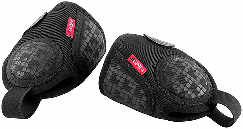 A pair of black GAIN Protection Pro Junior Ankle Protectors with padded, textured surfaces and red GAIN labels, designed for impact protection during physical activities.