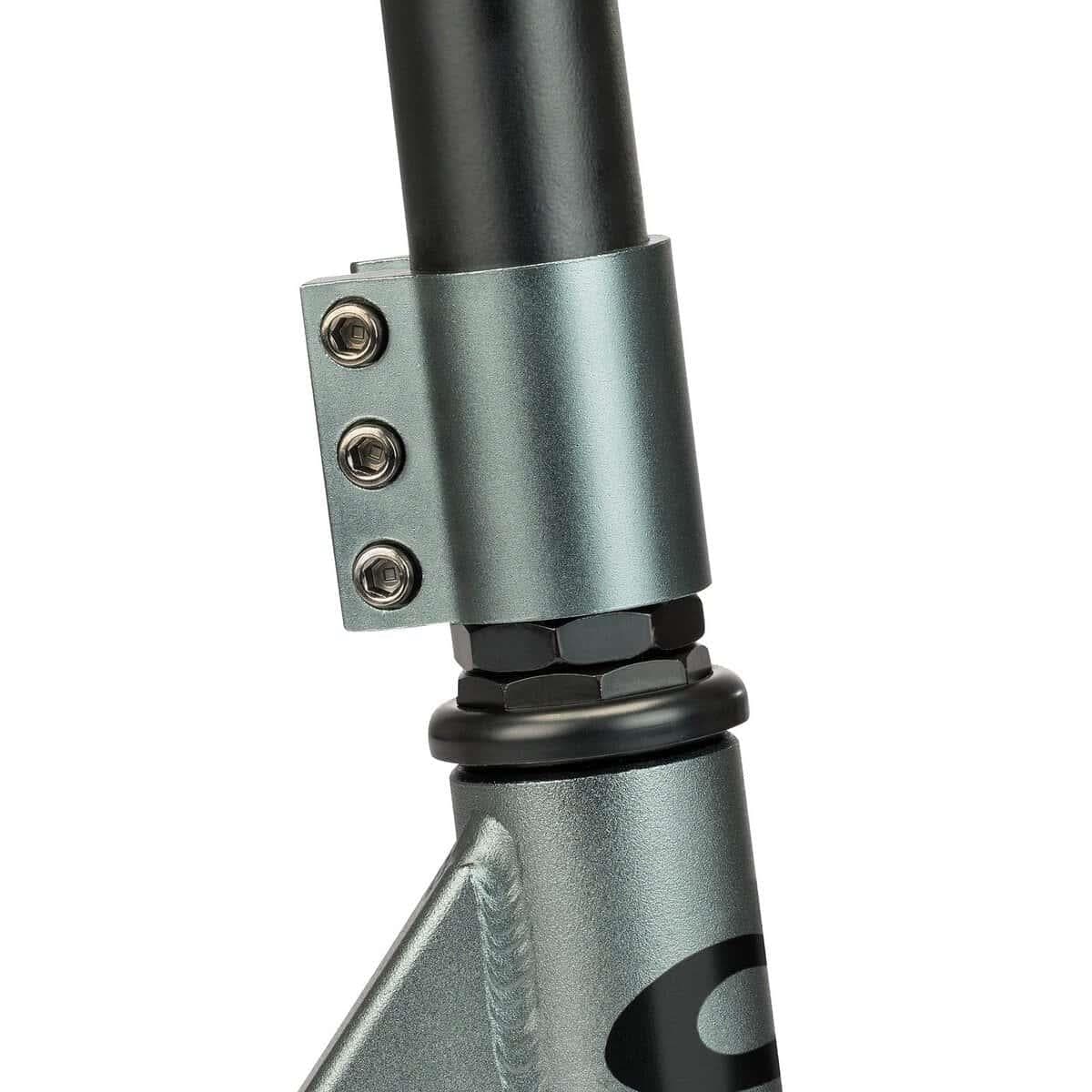 Close-up of the Osprey Complete Dirt Scooter's metallic clamp with three bolts, securing the handlebar to the fork. The gun metal grey finish and black accents offer durability for off-road stunts. Brand: Osprey.