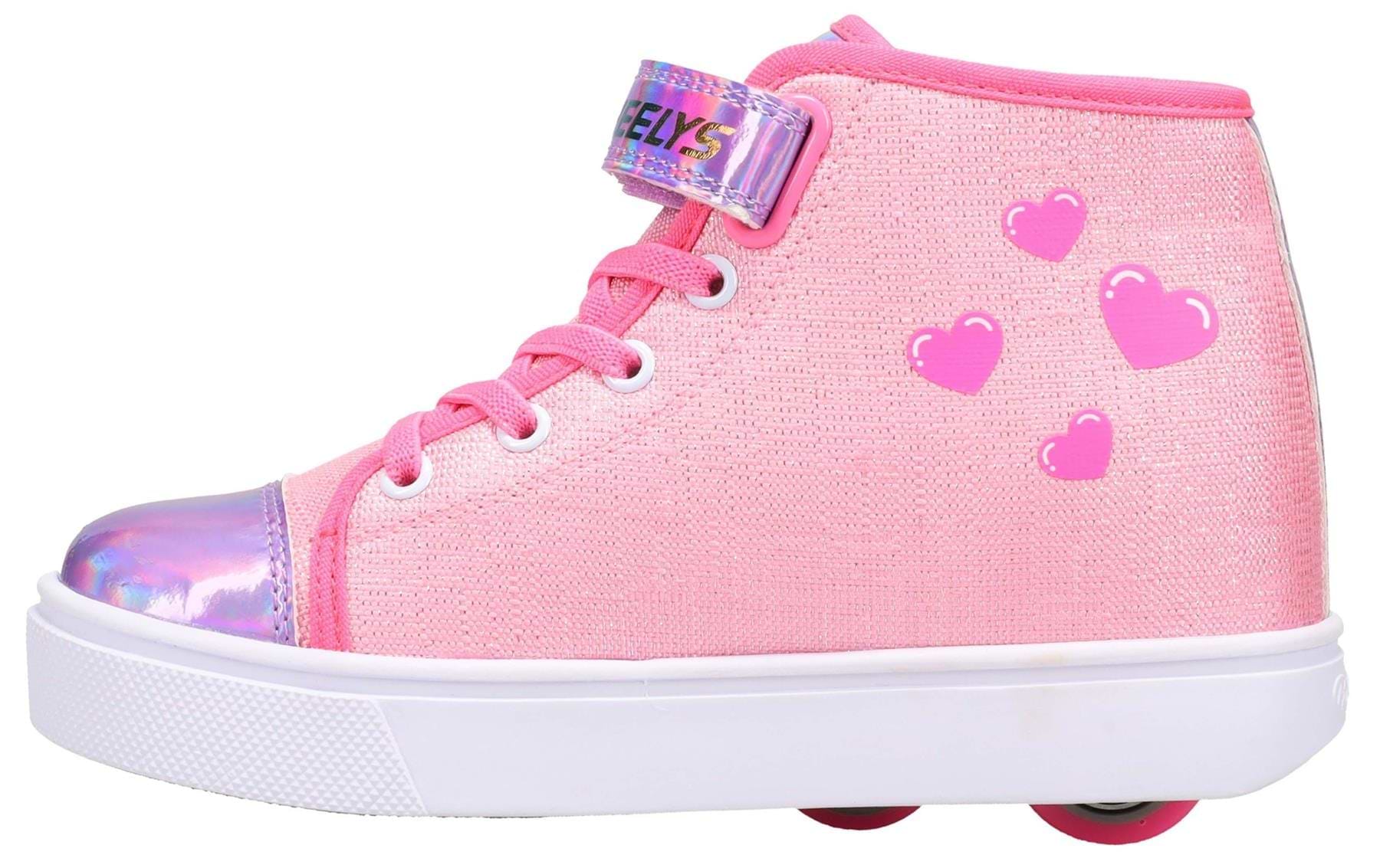 The Heelys Veloz X2 Prints Girls Shoes in Prism Pink/Neon Pink/Multi feature a sparkly synthetic upper, pink laces, iridescent toe cap, heart designs, hook-and-loop strap, and a white sole with low-profile wheels.