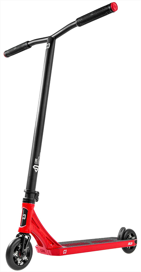 The CORE SL3 Complete Stunt Scooter by CORE, in red and black, features a wide handlebar with black grips, two small wheels, and a textured standing deck. This lightweight pro scooter is displayed upright on a white background.