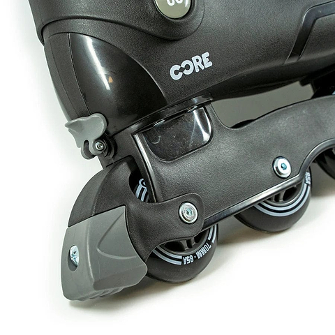 A close-up of the CORE Retro Adjustable Inline Skates in black reveals four 84mm wheels and subtle grey accents, with the brand name "CORE" prominently displayed in white on the boot. Its retro adjustable design is complemented by a robust aluminium frame, combining style and functionality.