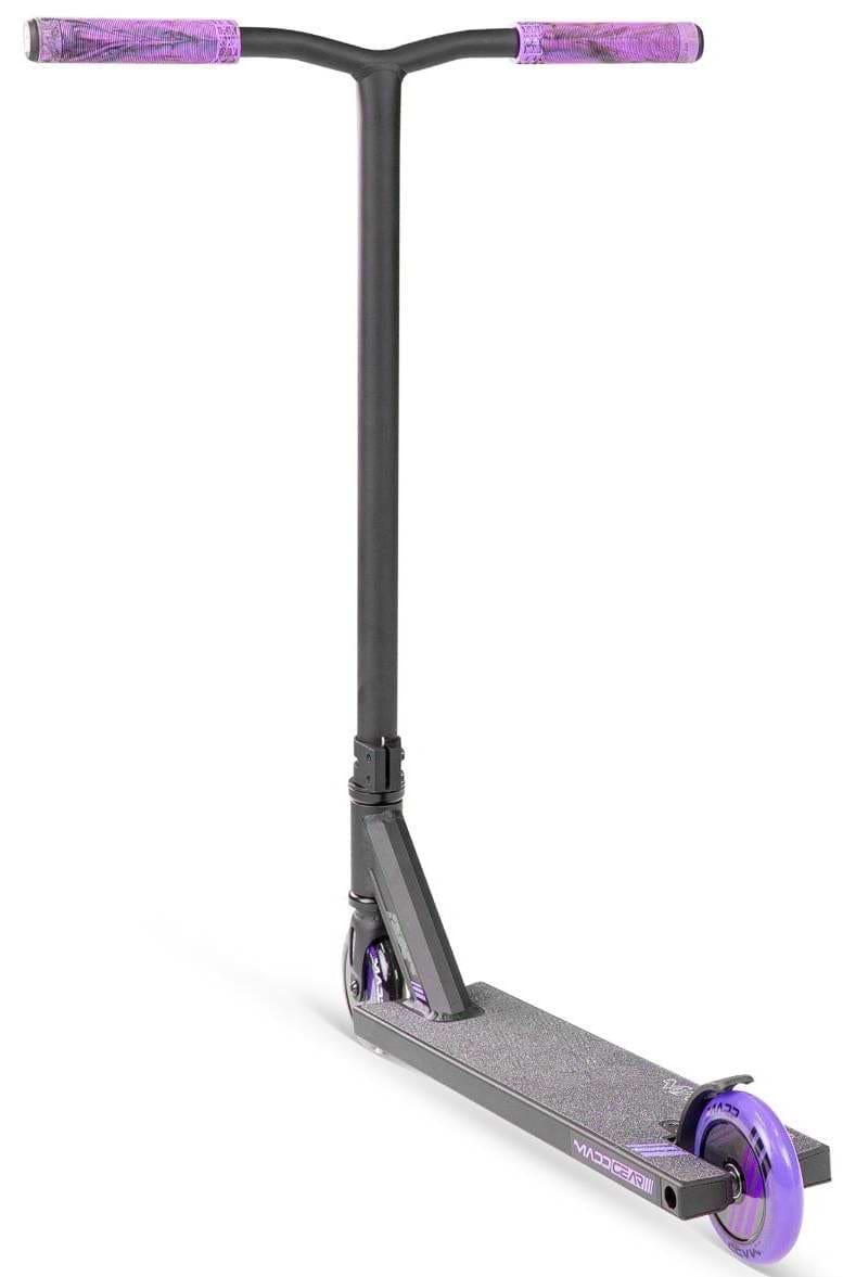 The Madd Gear MG 3 Zen Complete Stunt Scooter - Black/Lavender features a wide handlebar, purple grips, a purple rear wheel, and a textured deck for grip—ideal for tricks and stunts. Brand: Madd Gear (MGP).