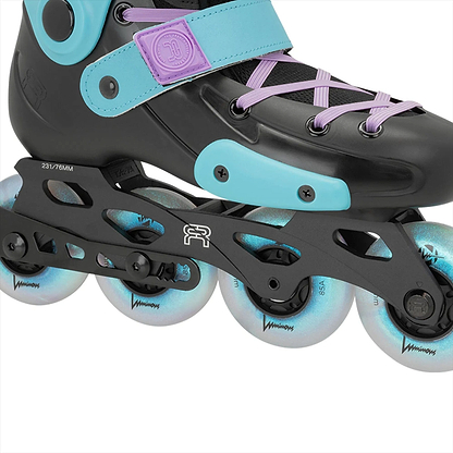 Close-up of the FR Skates Junior Adjustable Inline Skates, Luminous Black Pearl model. The sleek design features X2R rocker-able frames and four white wheels on a sturdy black frame with lavender laces, all in a black and turquoise finish.