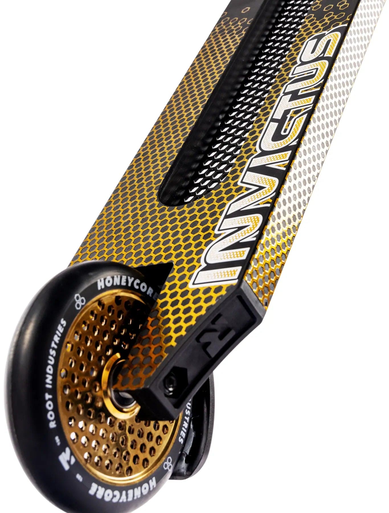 Close-up of the Root Industries Invictus V3 Complete Stunt Scooter - Burnt Gold, showing its gold honeycomb rear wheel and bold white “INVICTUS” lettering along the side.