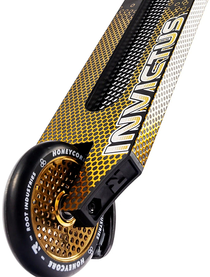 Close-up of the Root Industries Invictus V3 Complete Stunt Scooter - Burnt Gold, showing its gold honeycomb rear wheel and bold white “INVICTUS” lettering along the side.