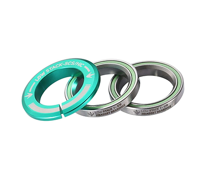 The Blunt Envy Low Stack SCS Integrated Stunt Scooter Headset in teal features a circular metal spacer with "LOW STACK-SCS/HIC" text, alongside two fully sealed bearings. This design ensures seamless integration with an SCS compression system and perfectly complements the silver tones of the bearings.