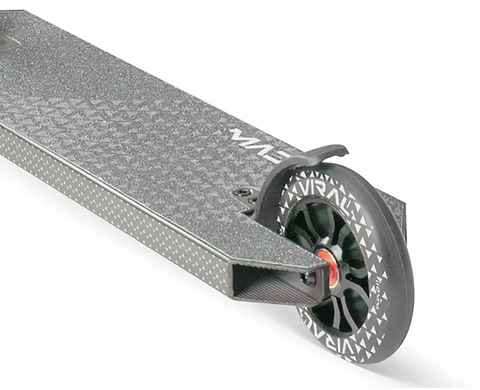 Close-up of the Madd Gear Viral KAOS Complete Stunt Scooter - Forest deck shows the textured grip, black wheel with white pattern, and red accents near the axle—ideal for stunt progression.