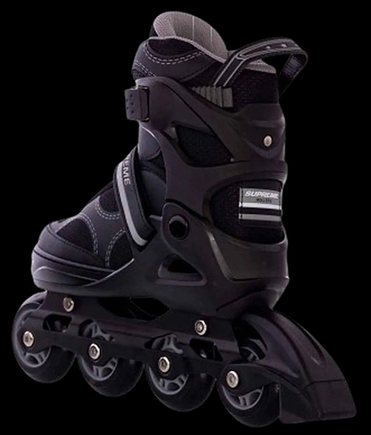 The Supreme Venice Adjustable Kids Inline Skates in Black/Grey by Supreme offer four wheels, adjustable sizing, supportive ankle cuff, and secure straps—perfect for beginners and shown against a sleek black background.