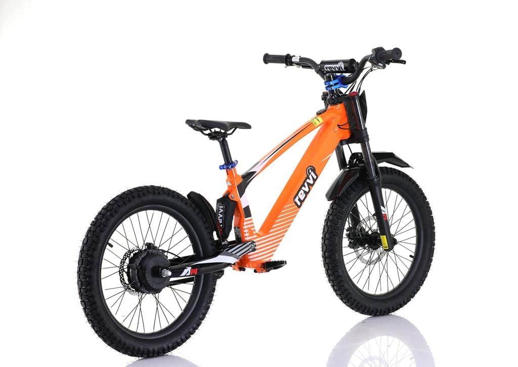 The Revvi 20" Kids Electric Balance Bike features an orange design with black handlebars and off-road rubber tires, perfect for rugged terrains. It includes a thick frame, suspension fork, and rear shock absorber, ideal for adventurous kids. The branding is highlighted on a plain white backdrop.